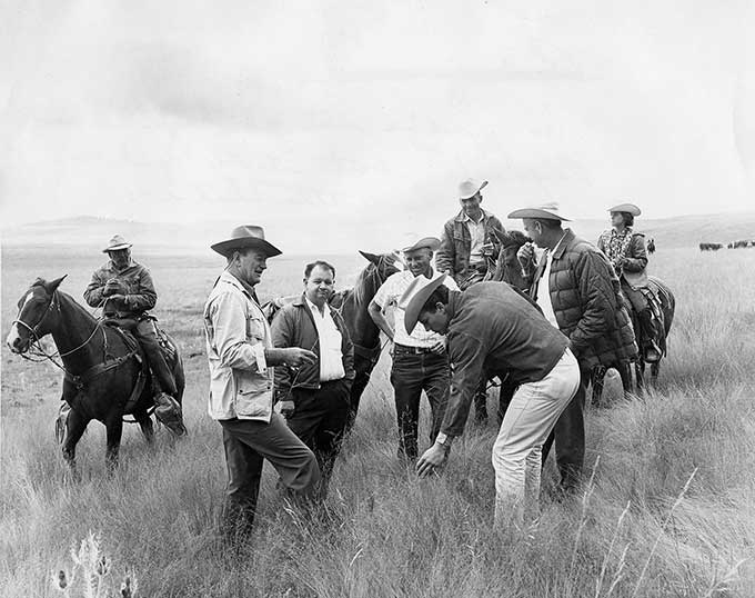 John Wayne, Louis Johnson, son Patrick Wayne and friends at 26 Bar Ranch.