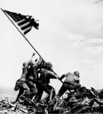 soldiers raising flag