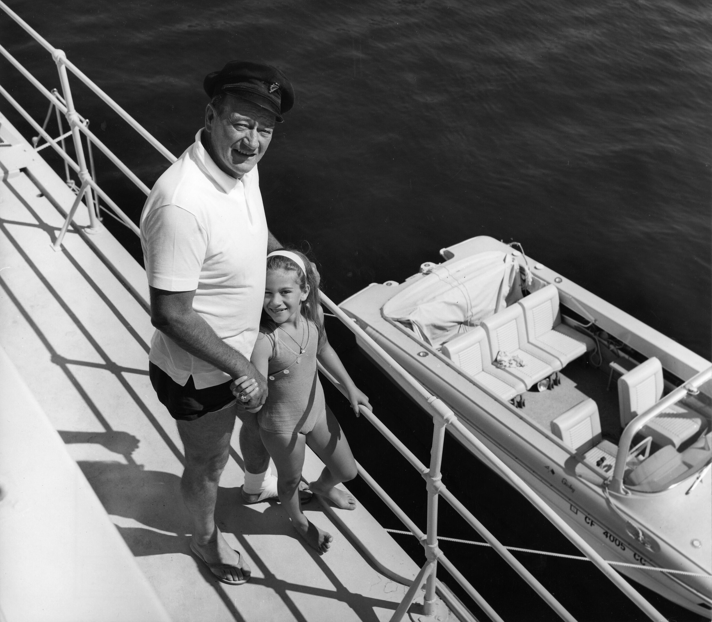 John Wayne and Aissa aboard the Wild Goose in Majorca, Spain.