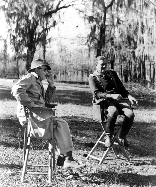 John Ford and John Wayne on the set of The Horse Soldiers (1959). Photo courtesy of United Artists