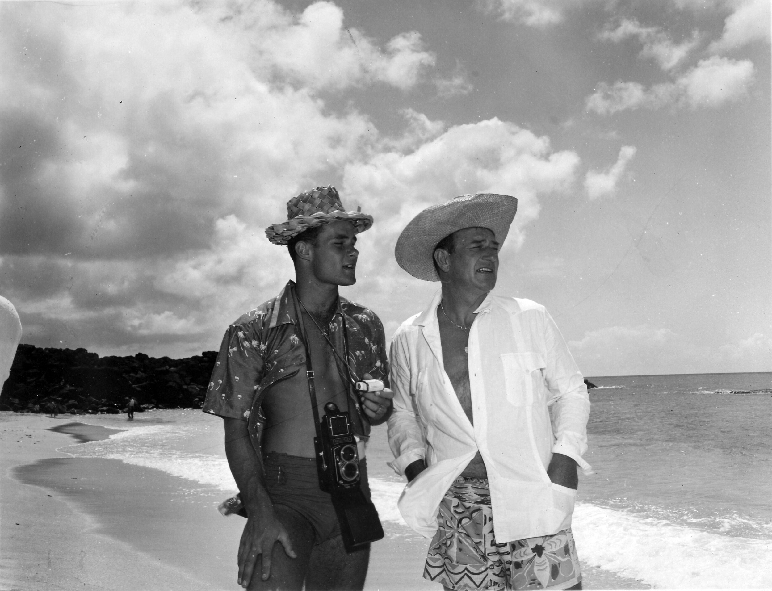 Michael with his Dad on the beach in Hawaii.