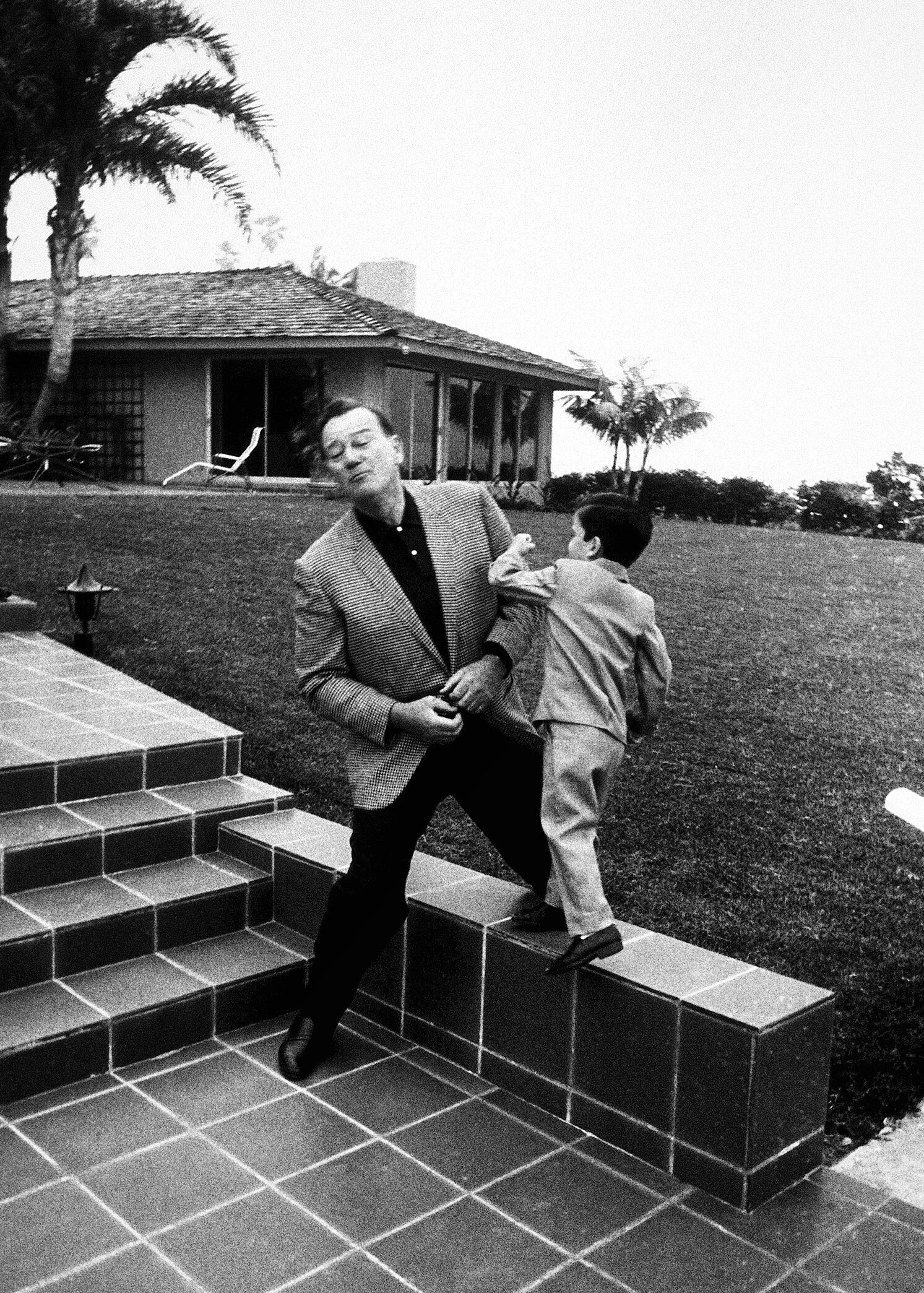 Ethan and his dad play fighting at their home in Newport Beach, circa 1965.