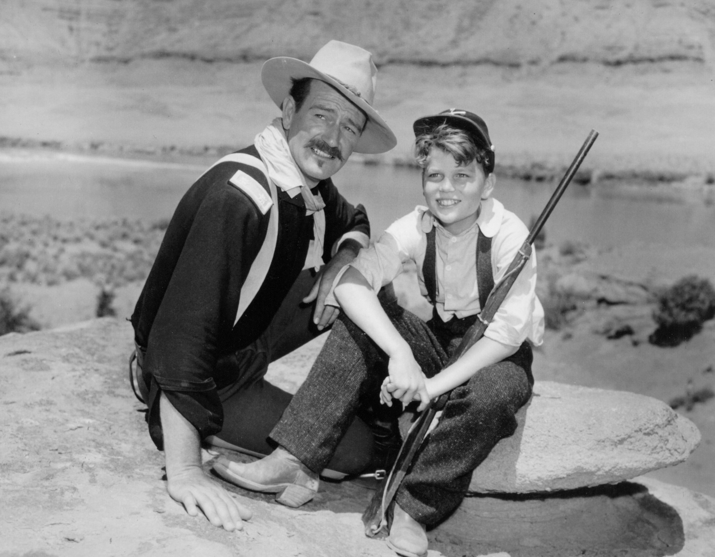 John Wayne (left) and Patrick Wayne (right) on the set of Rio Grande in 1950. Photo courtesy of John Wayne Enterprises