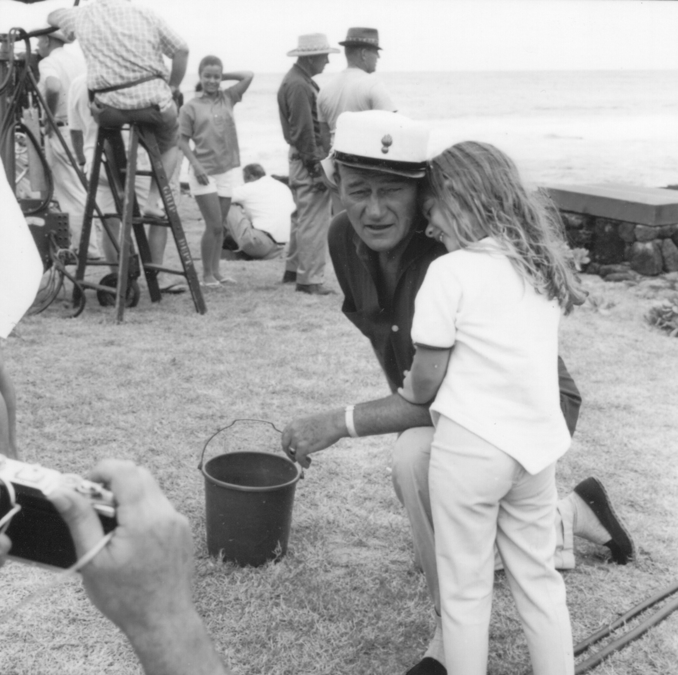 Aissa leans on her dad while in Hawaii for the filming of Donovan’s Reef (1963).