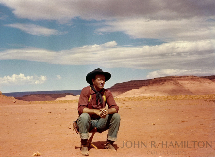 The final version after color correction- John Wayne between takes while filming The Searchers (1956). Image by John R. Hamilton, photo courtesy of John Wayne Enterprises. Print available for purchase at johnhamiltoncollection.com