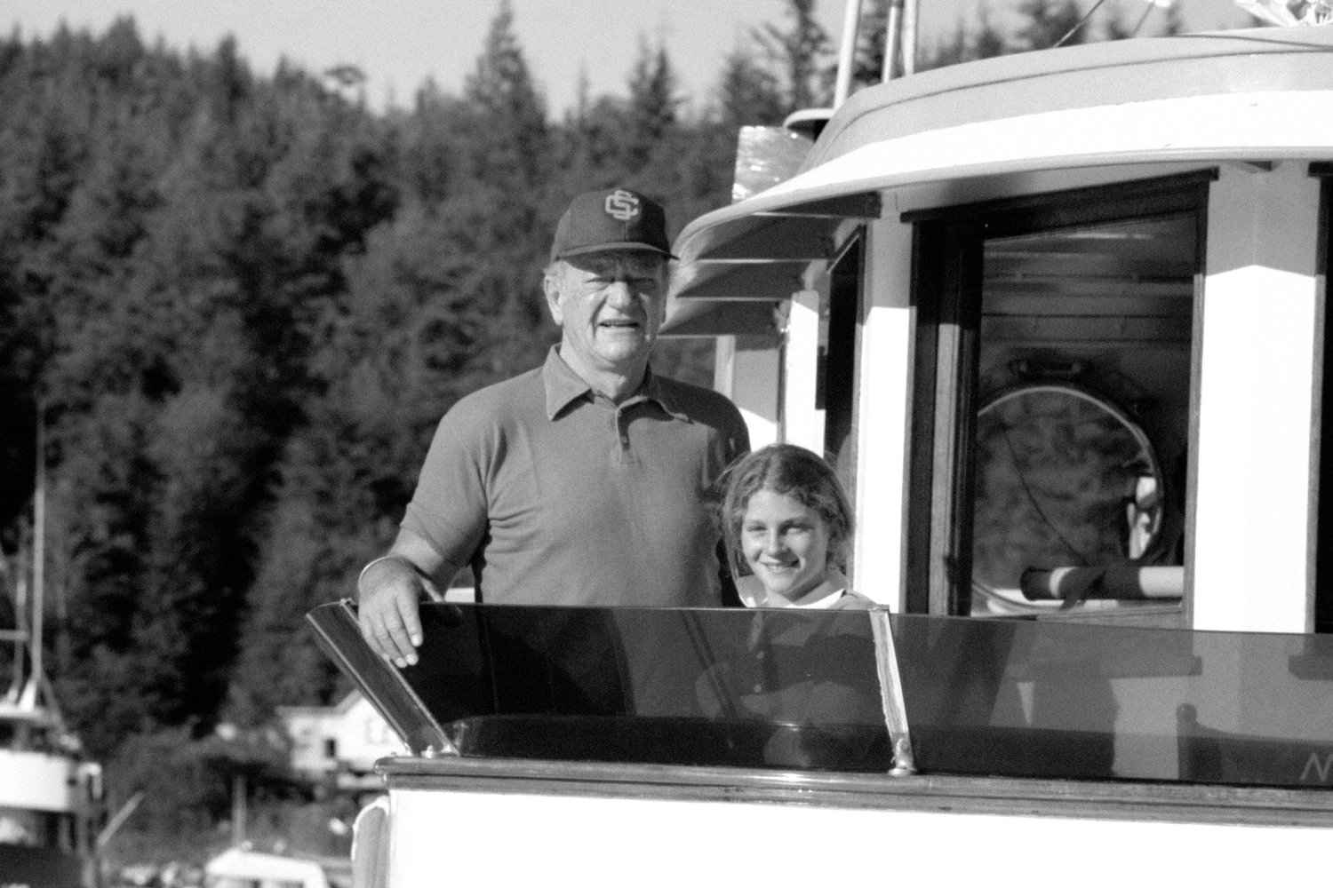 John Wayne and Marisa Wayne aboard Duke’s boat the Wild Goose in the Pacific Northwest. Photo courtesy of John Wayne Enterprises