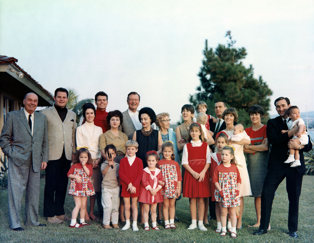 The entire Wayne Family poses for their Christmas card photo at John Wayne’s home in Newport Beach, California, circa 1965. Photo courtesy of John Wayne Enterprises