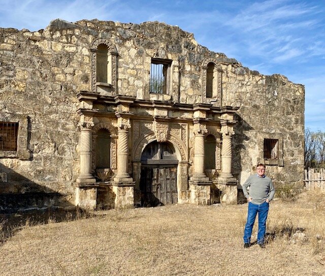 John Wayne fan and Texas Lt. Gov Dan Patrick in front of a replica of the famous Alamo Village mission in Texas. Photo courtesy of Dan Patrick.