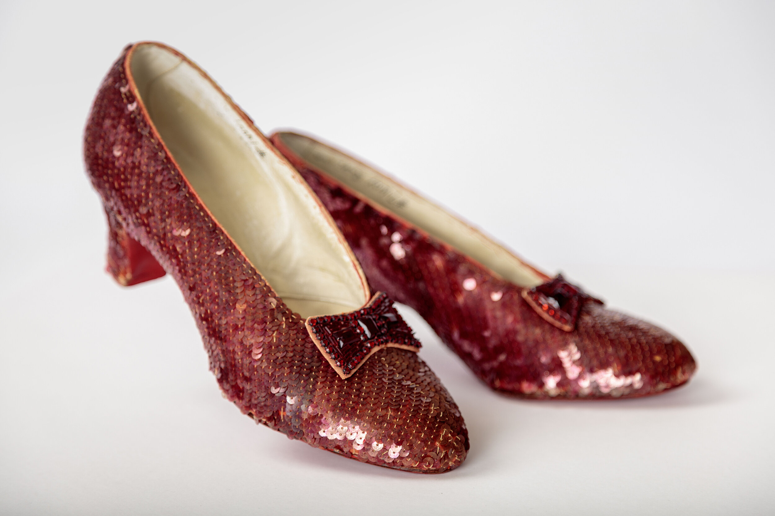 On display: Screen-used close-up pair of the Ruby Slippers, designed by Adrian, from The Wizard of Oz (1939). Academy Museum of Motion Pictures. Photo by Joshua White, JWPictures/©Academy Museum Foundation.