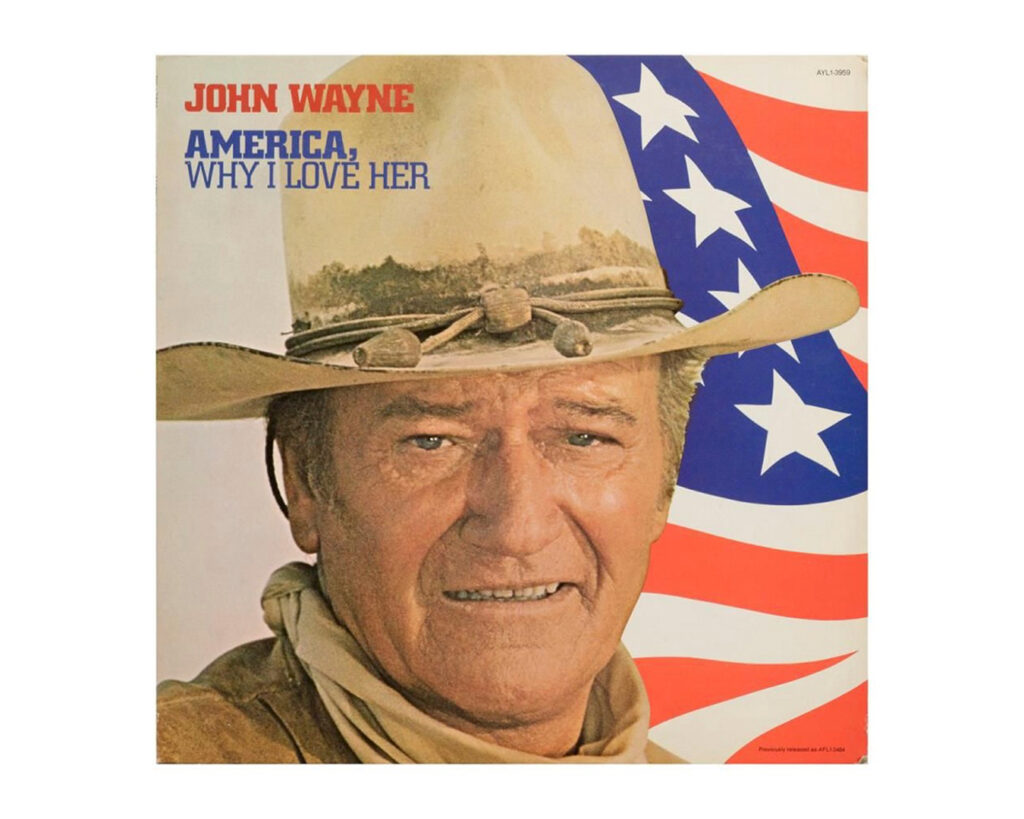 Album cover of 'America, Why I Love Her' featuring a close-up portrait of a person wearing a cowboy hat and bandana against an American flag background, with red text 'JOHN WAYNE' and blue text 'AMERICA, WHY I LOVE HER' at the top